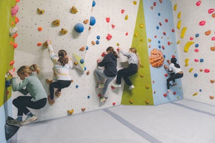 Five girls enjoy a session at a Spider Climbing centre