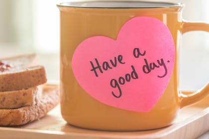 Mug of tea with 'Have a good day' post it