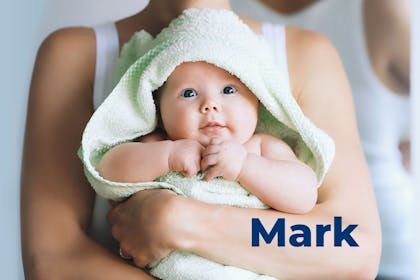 Baby wrapped in green towel being held by mum. Name Mark written in text