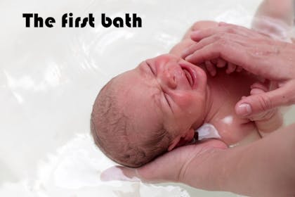 newborn baby in bath
