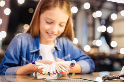 Young girl choosing nail colours at a nail salon