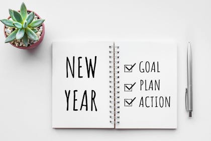 Diary with new year goals written in it