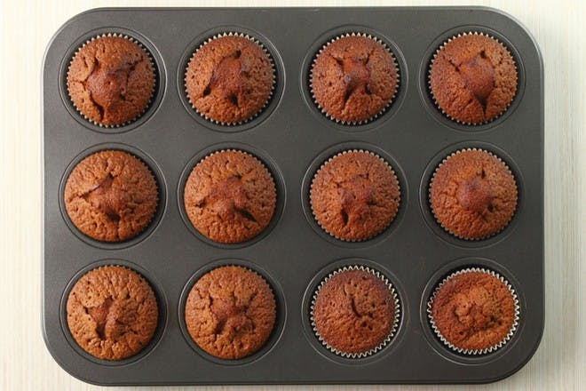 Baking tray of chocolate cupcakes