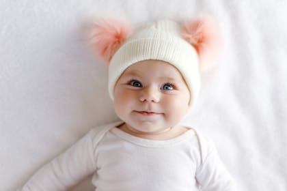 Smiling baby in cute hat