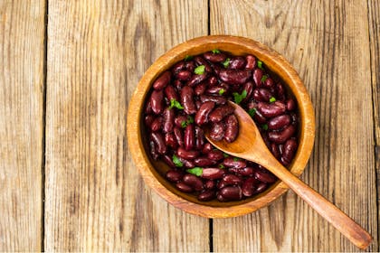 A wooden bowl of red kidney beans