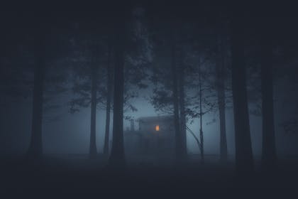 Spooky house in foggy woods