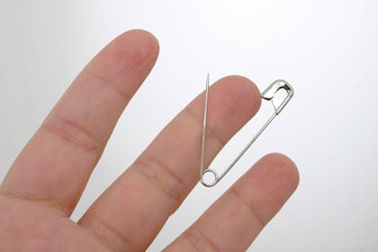 safety pin through thick skin of finger