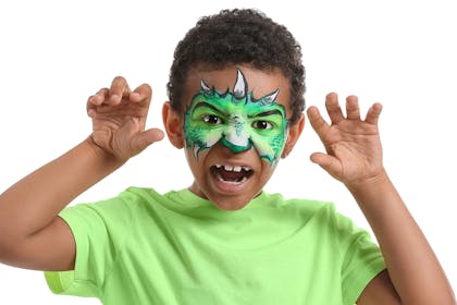 Boy with dinosaur/dragon face paint