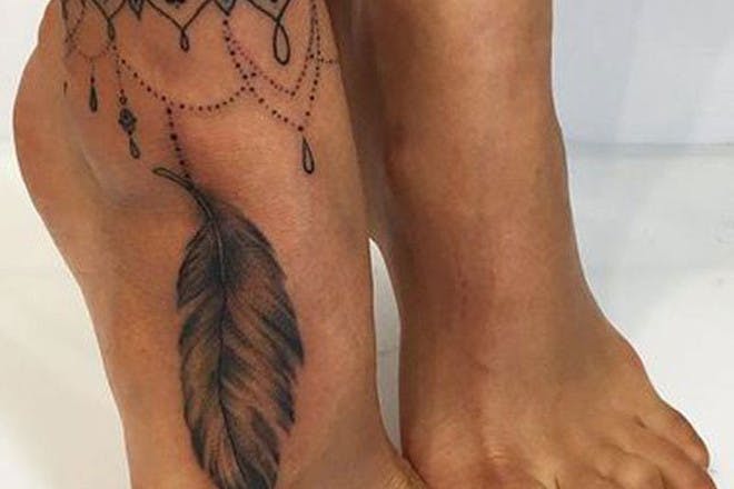 Feather foot tattoo