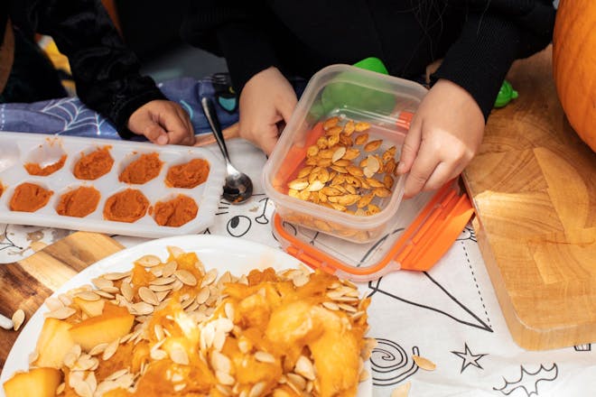 Children making things from cooked pumpkin