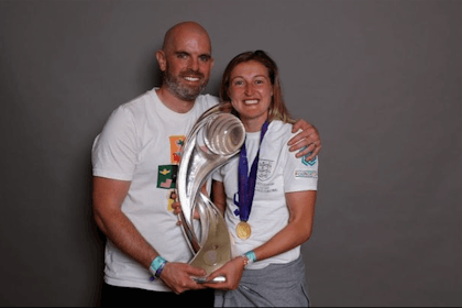 Ellen White and husband Callum holding Euros trophy