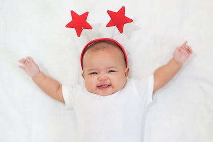 Baby wearing a red star headband