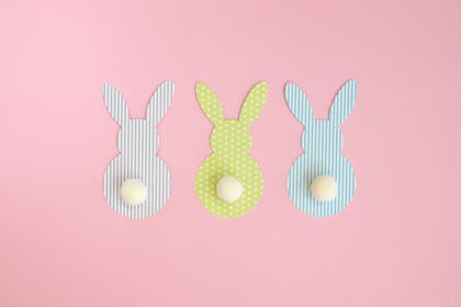 Cutout Easter bunnies with pompom tails