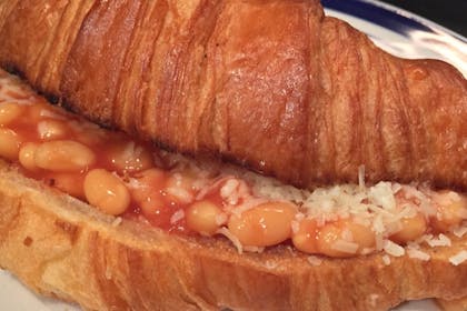 68. Croissant with baked beans