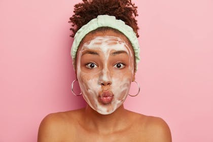 Teenager wearing foaming face mask