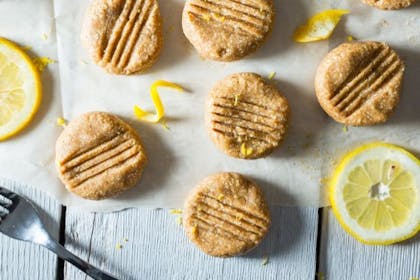 lemon cookies and lemon slices on baking paper