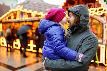 Man and daughter at Christmas market