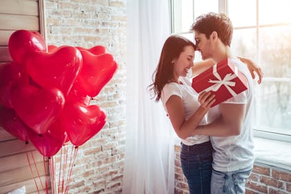 Couple with heart balloons