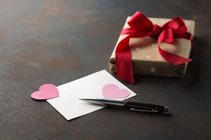 Blank Valentine's card and gift with paper hearts
