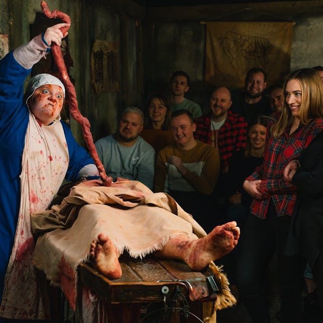 An actor entertains the crowds at the London Dungeon
