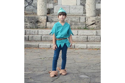 Boy dressed in Peter Pan costume