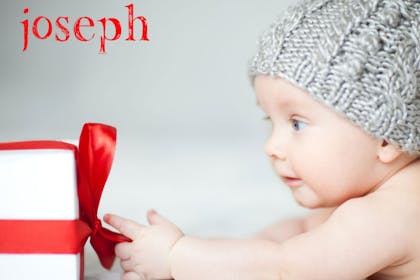 Baby grabbing gift with a red bow