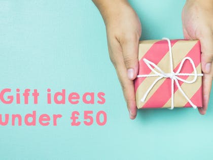 Hands holding present on mint background. text says Gift ideas under £50