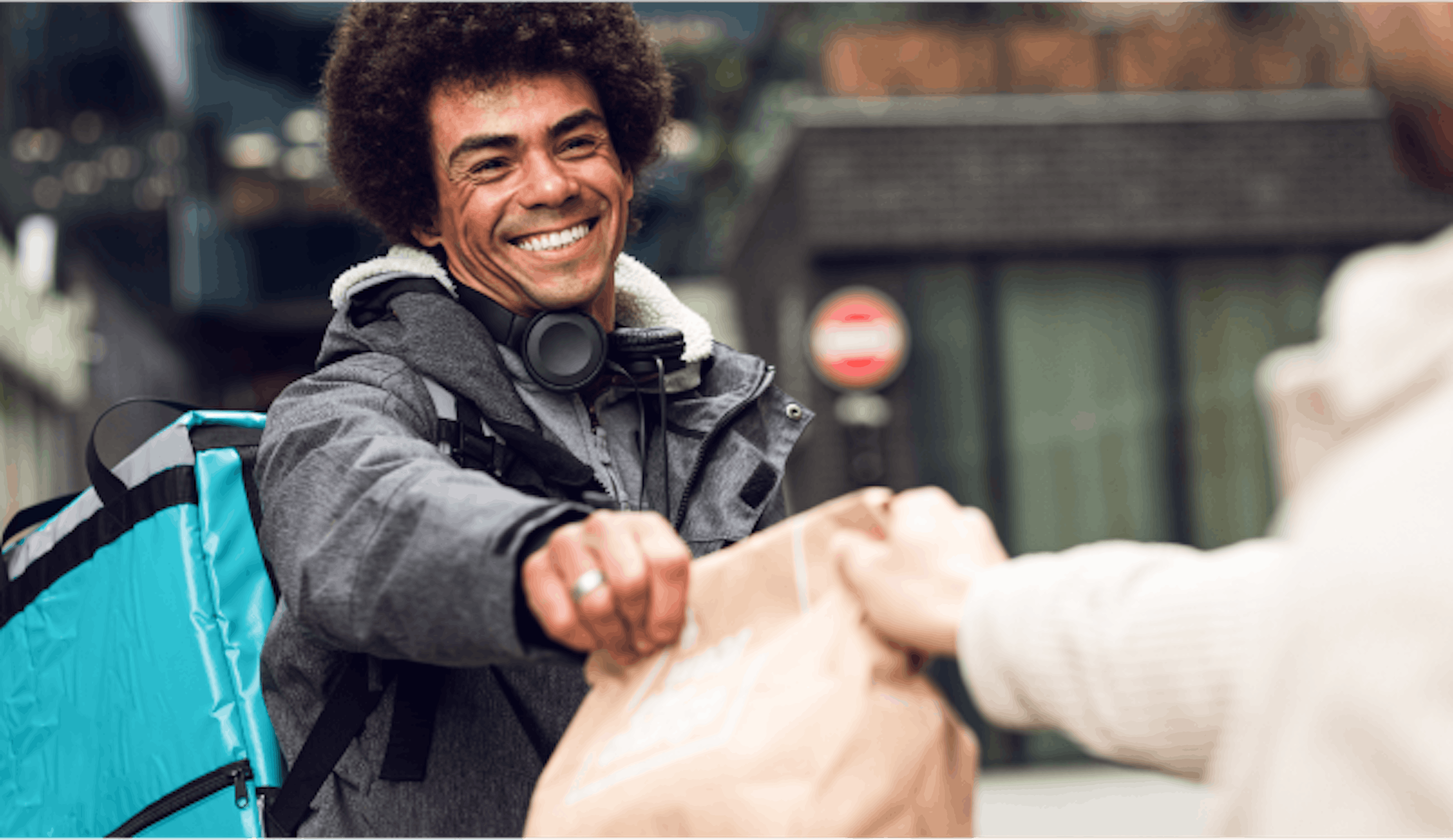 Image of a delivery rider collecting a package