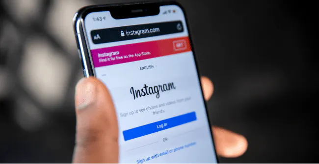Image of someone logging into Instagram from their iPhone