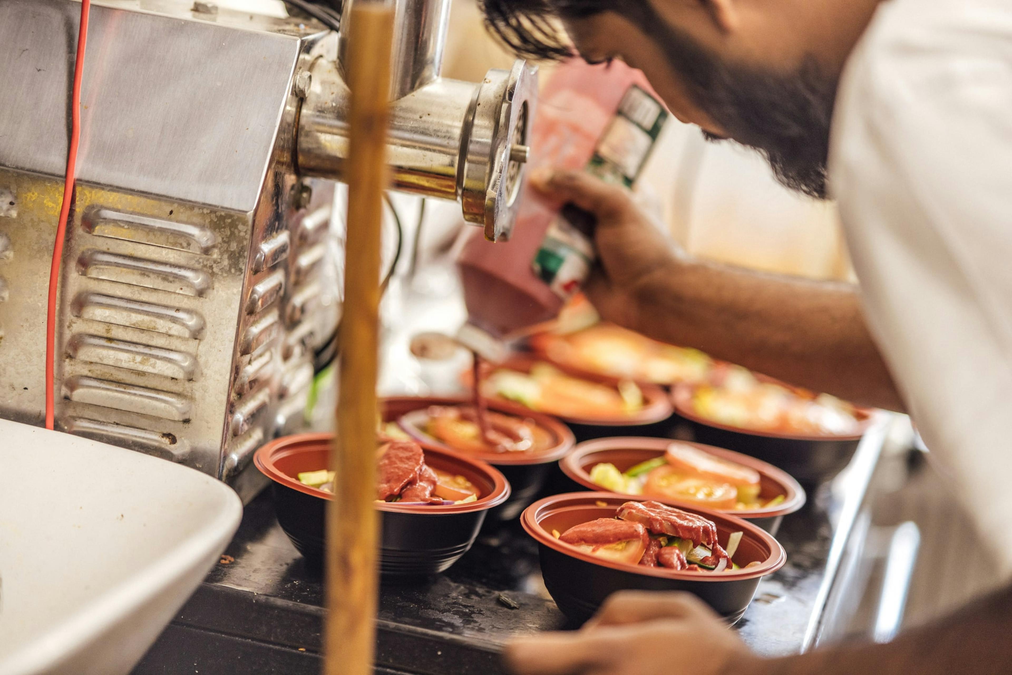 Image of a restaurant staff preparing food for delivery