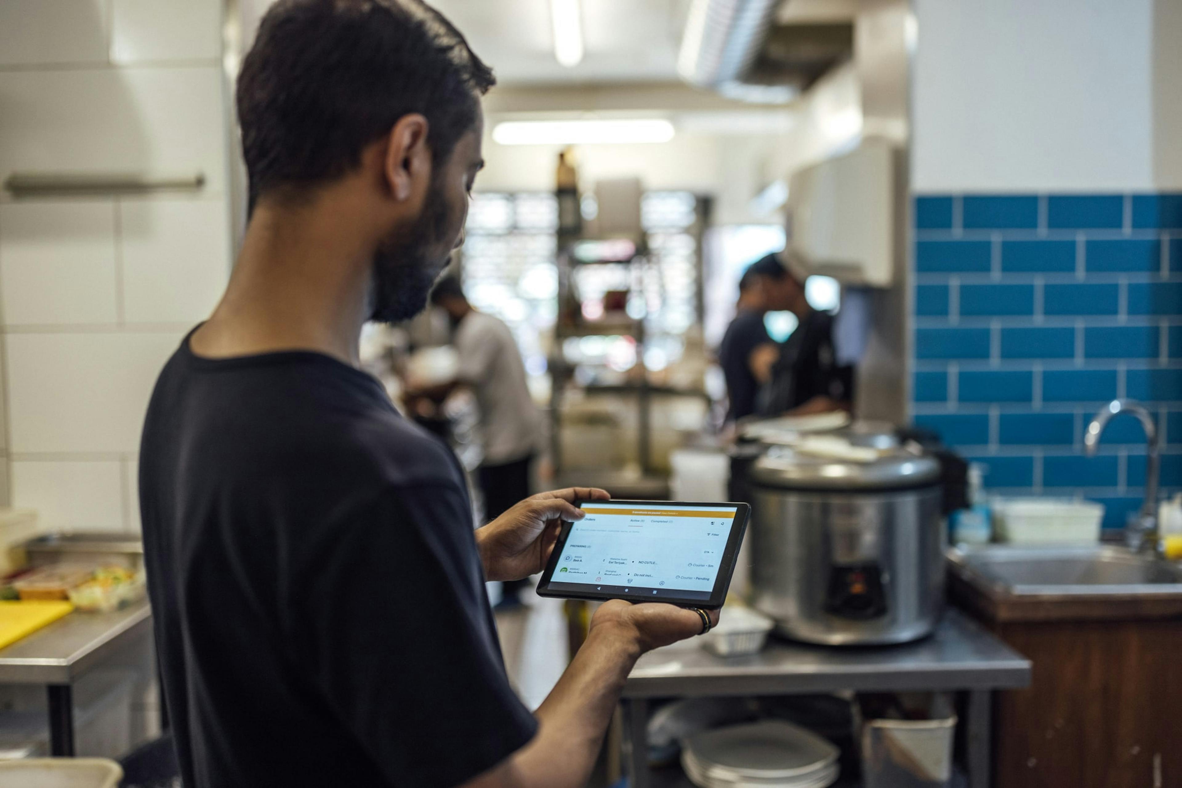 Image of Geezy's owner using the Otter tablet