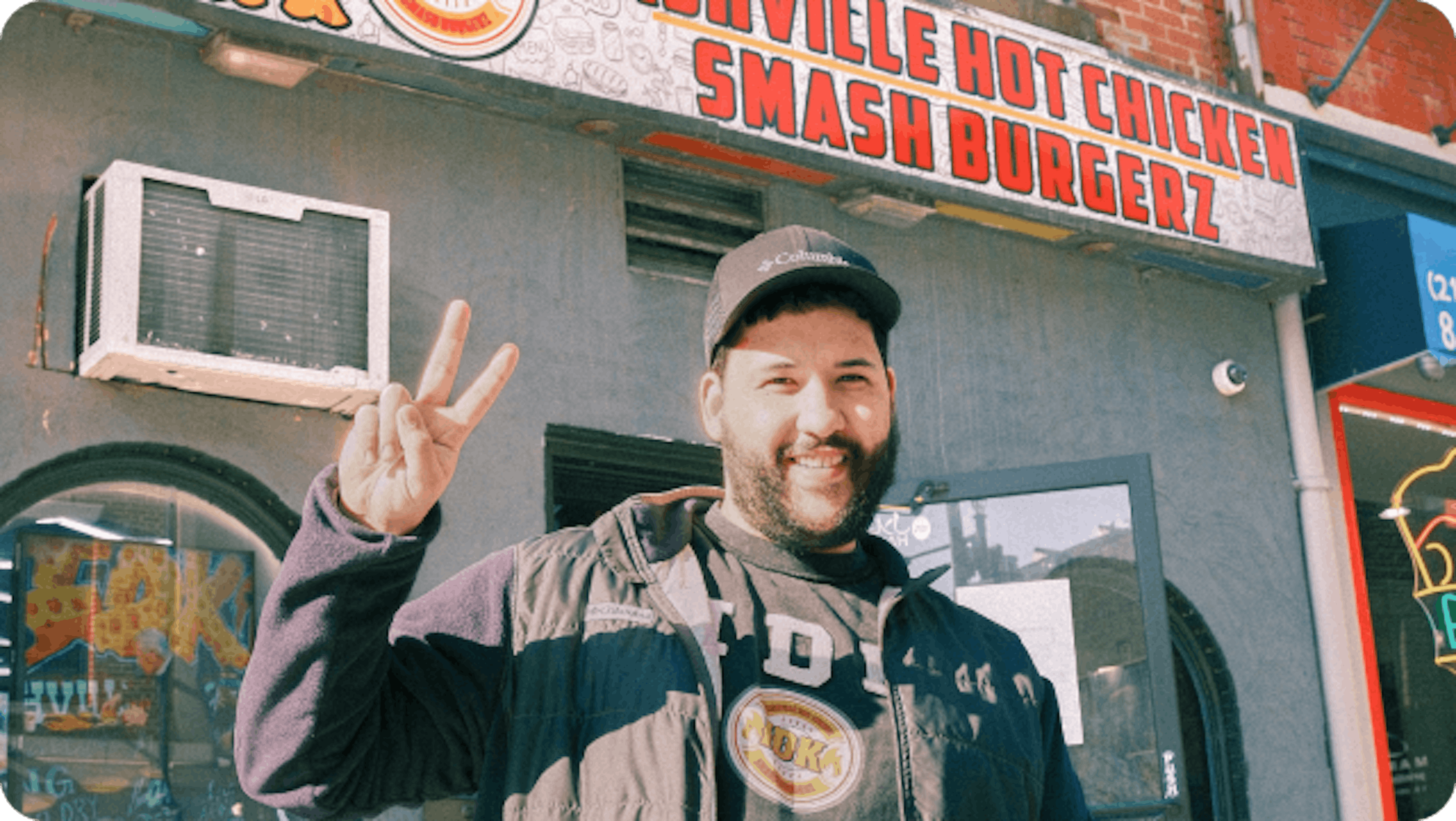 Reda, Owner at IDK Philly standing in front of his restaurant