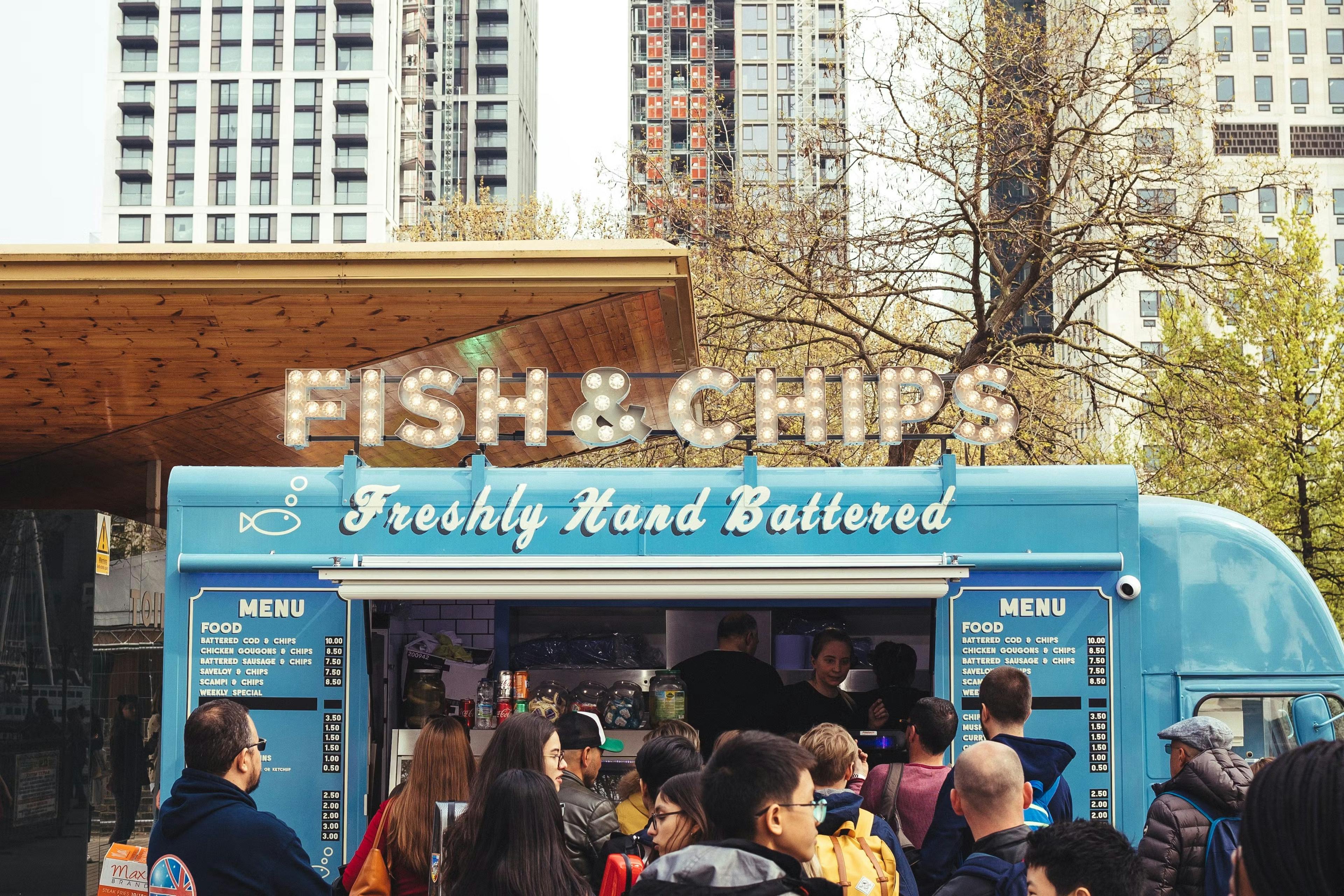 Fish and chips food truck with customers