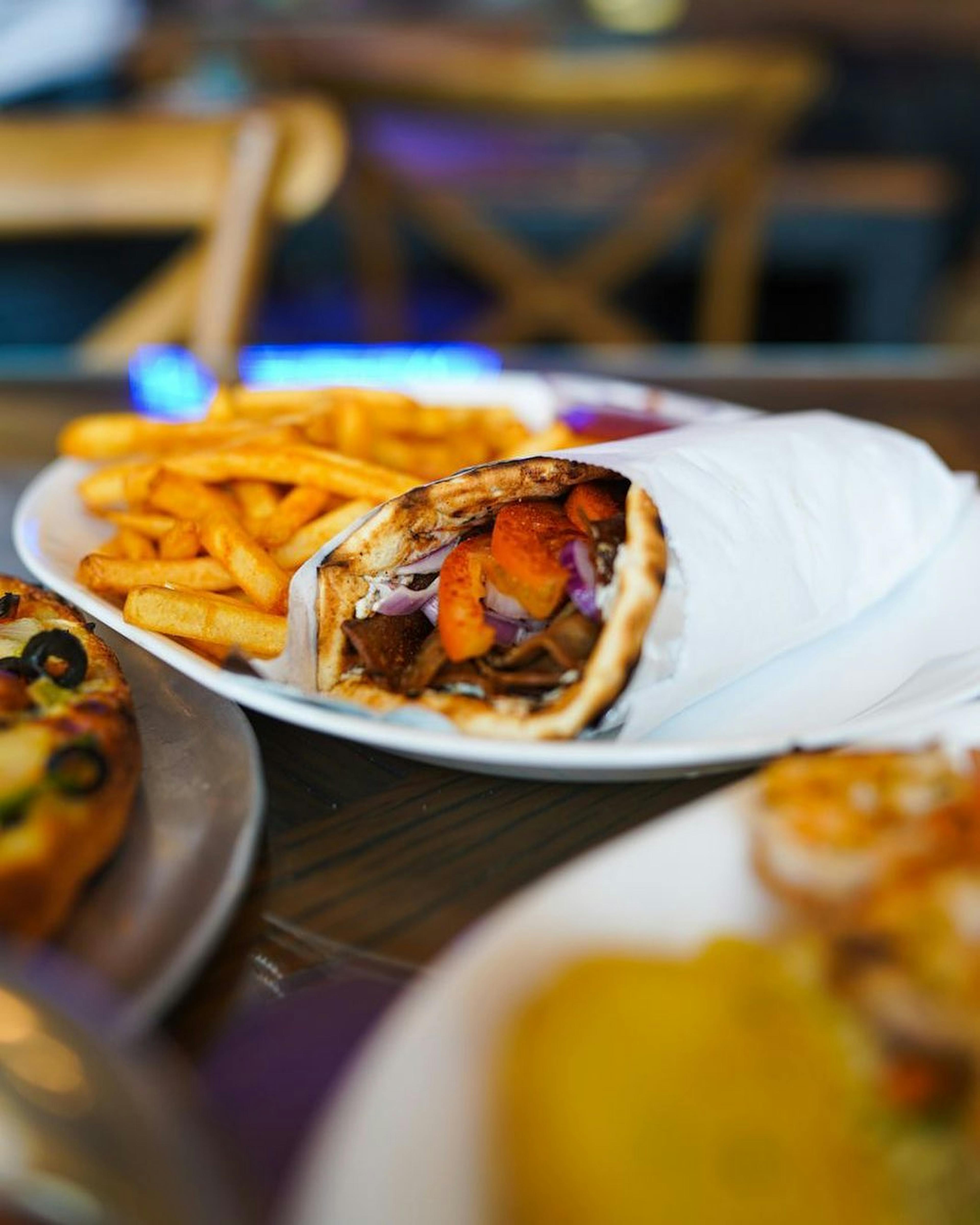 Image of a pita sandwich and french fries from Argo Greek Cuisine