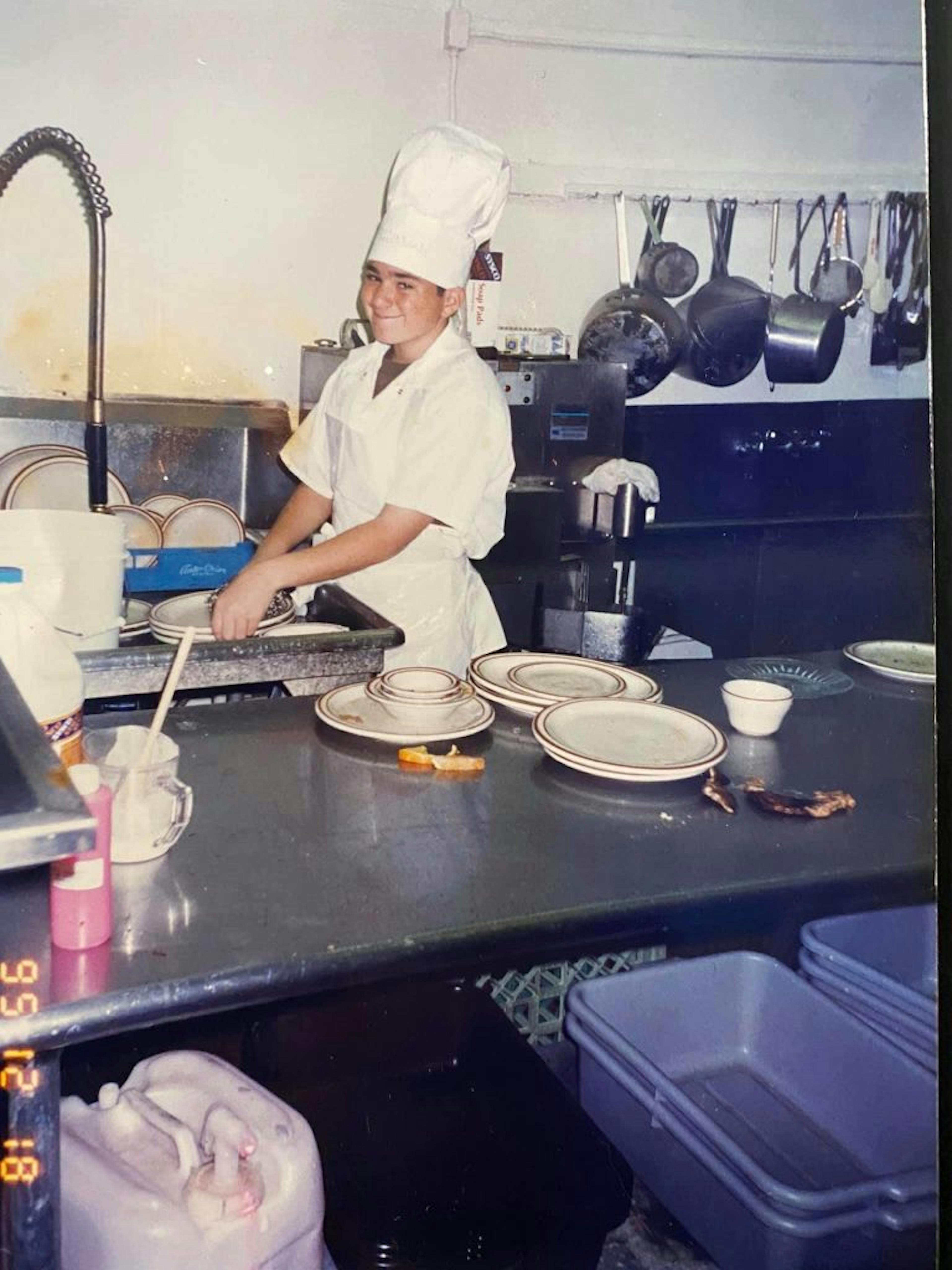 Image of Shawn Walchef as a kid cooking in his family's breakfast restaurant