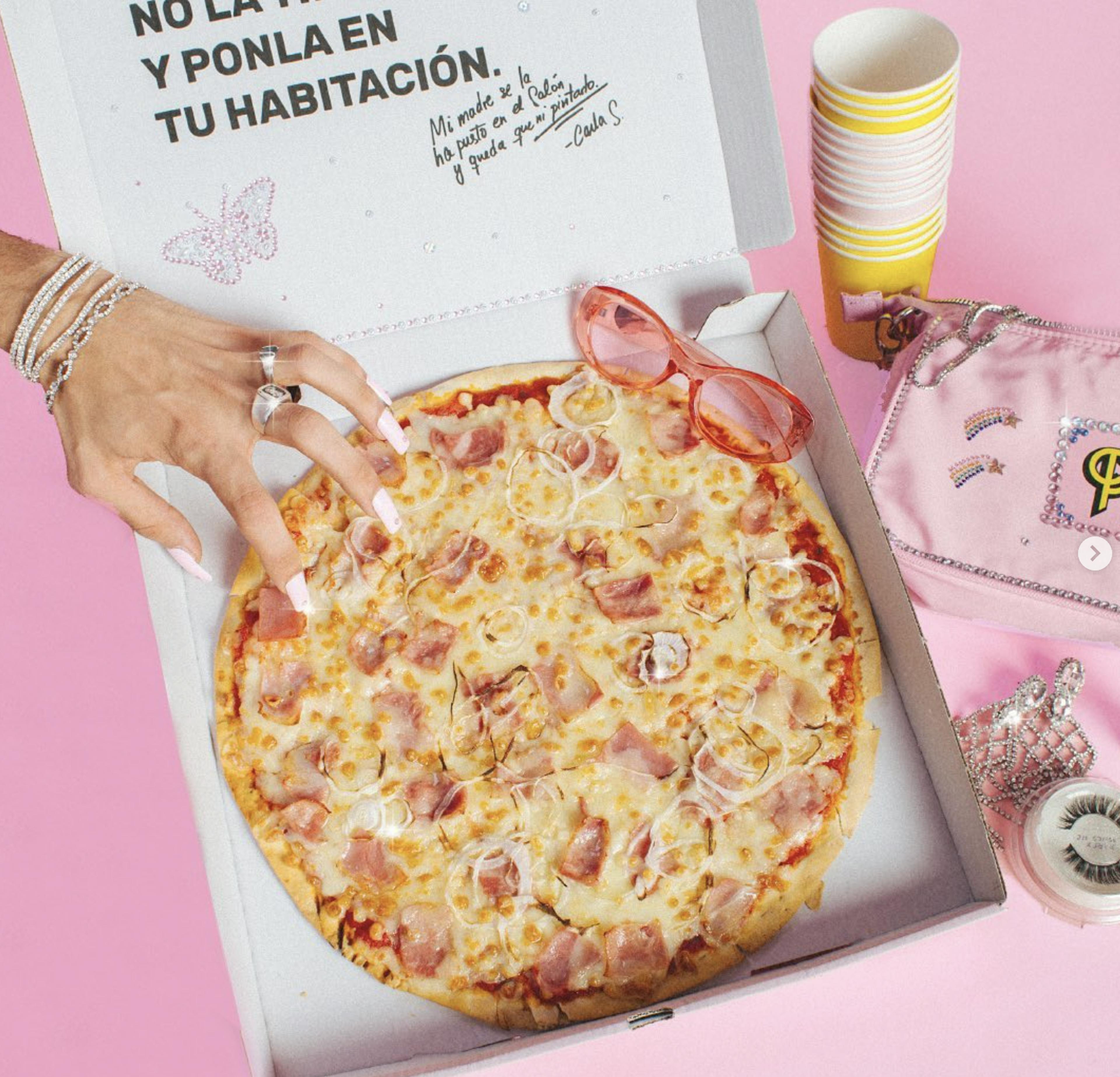 Image of pizza from Pizzaclik on a bright pink background