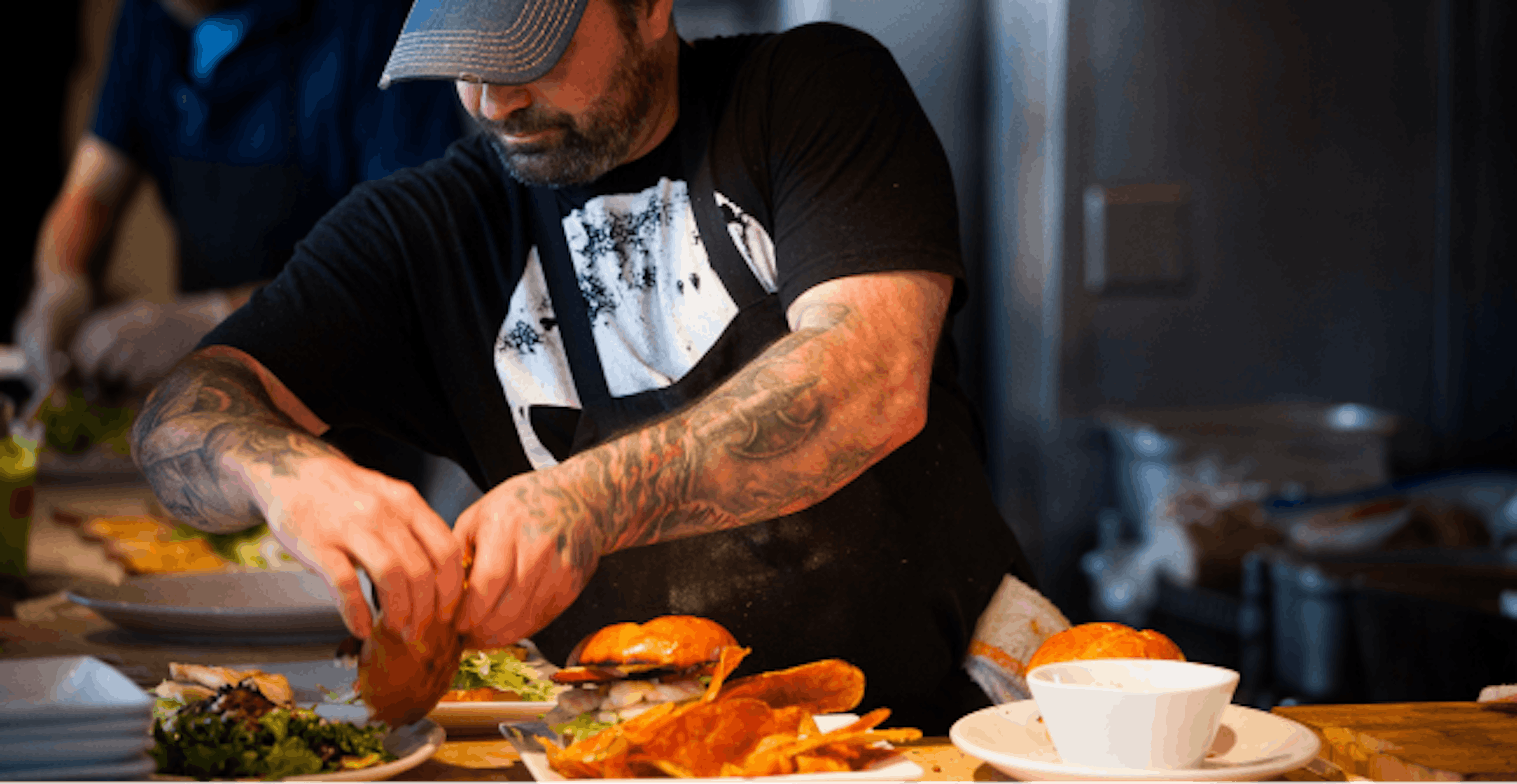 Image of a restaurant employee preparing food 