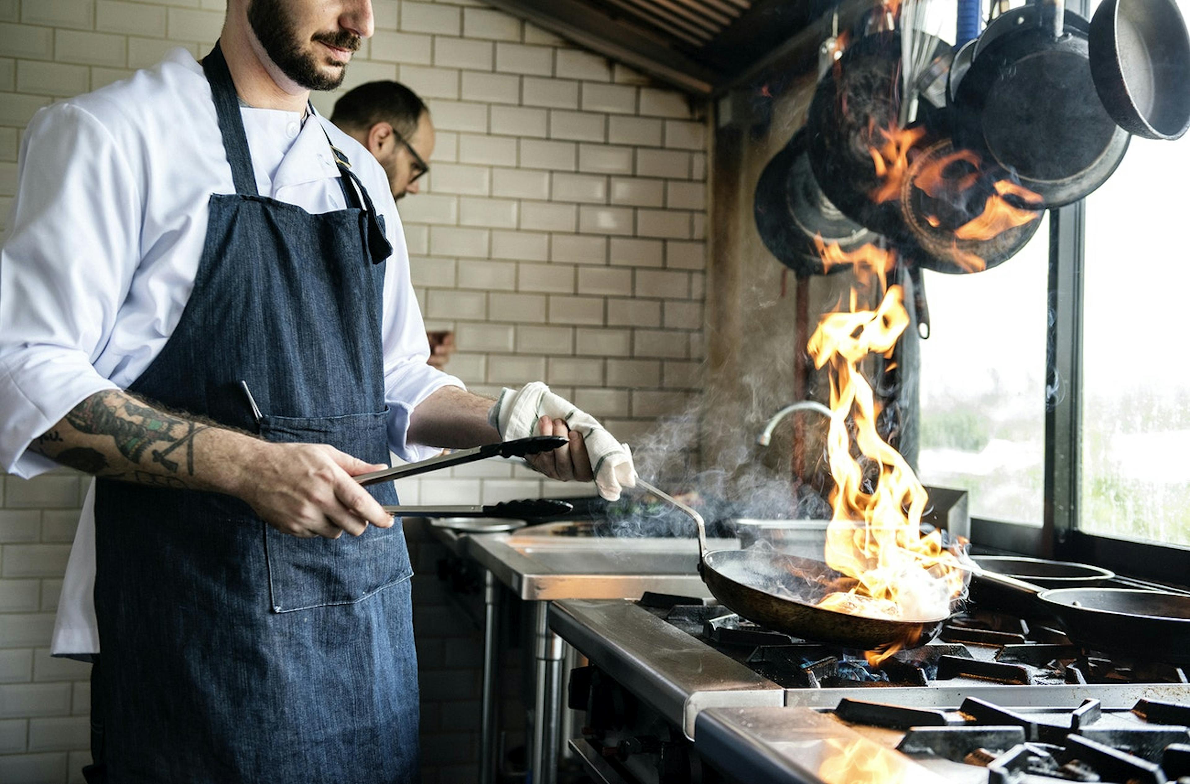 Image of restaurant chef cooking in a ghost kitchen space