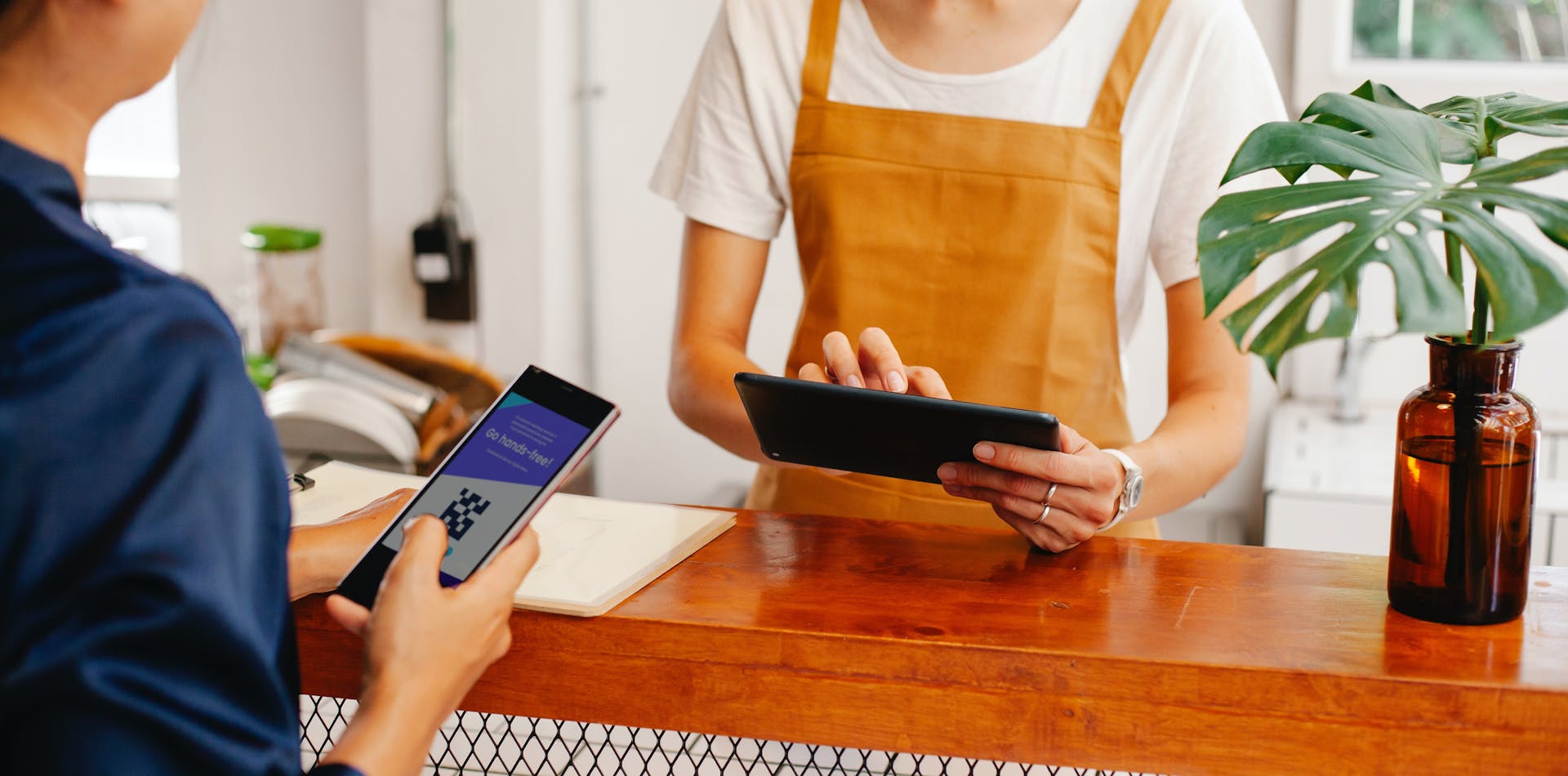 Restaurant customers and staff using QR codes.