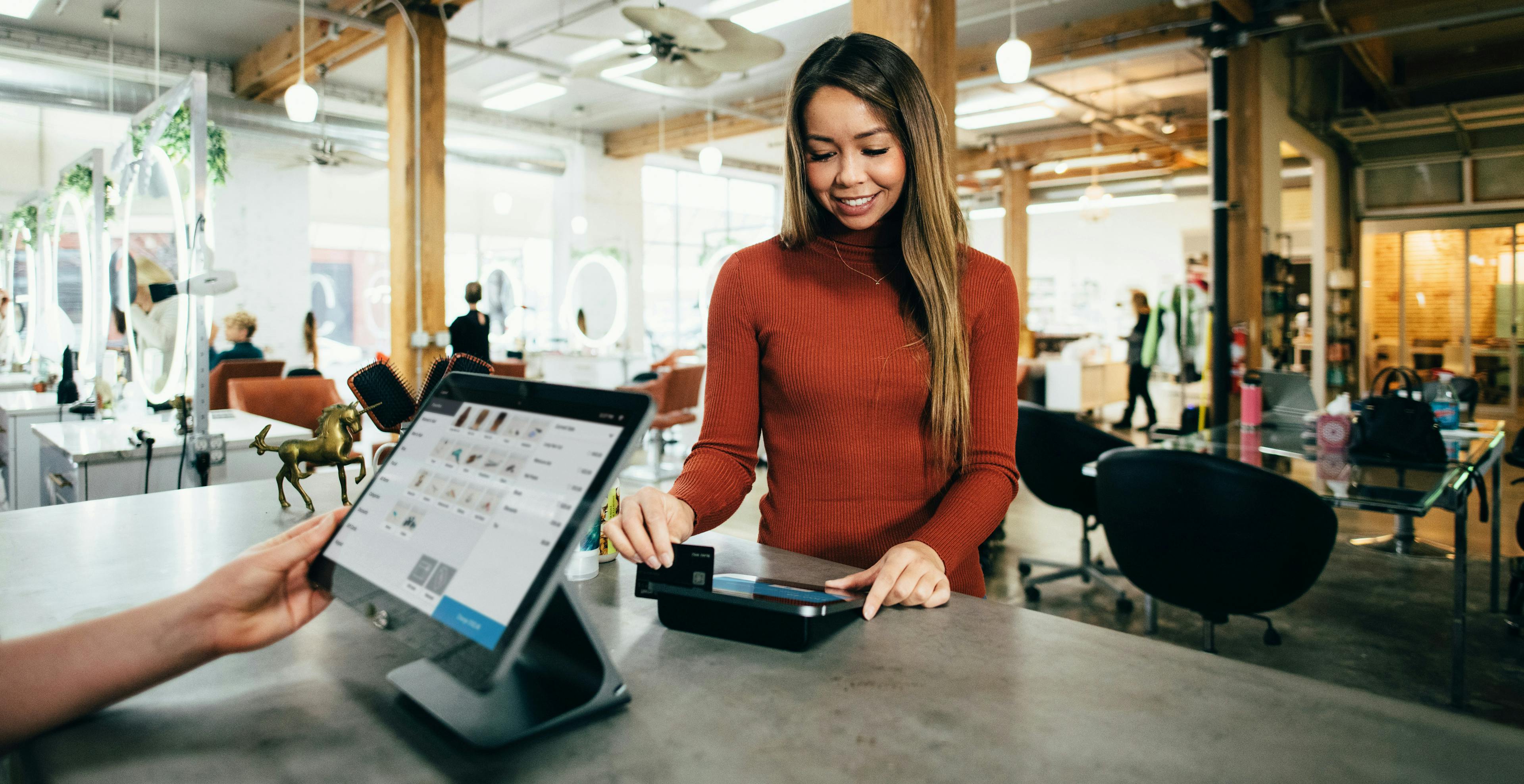 A customer using a restaurant POS system. 