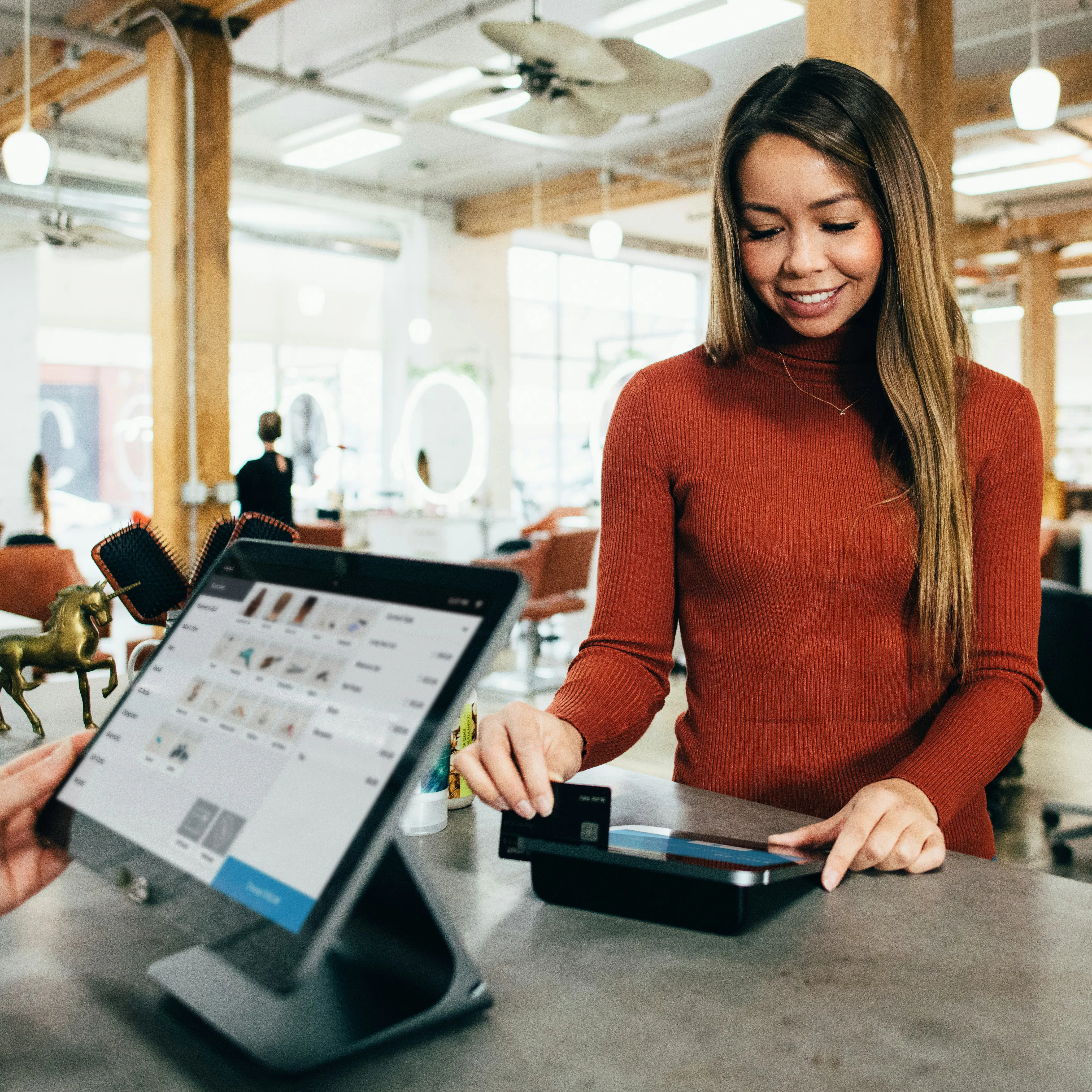 A customer using a restaurant POS system.