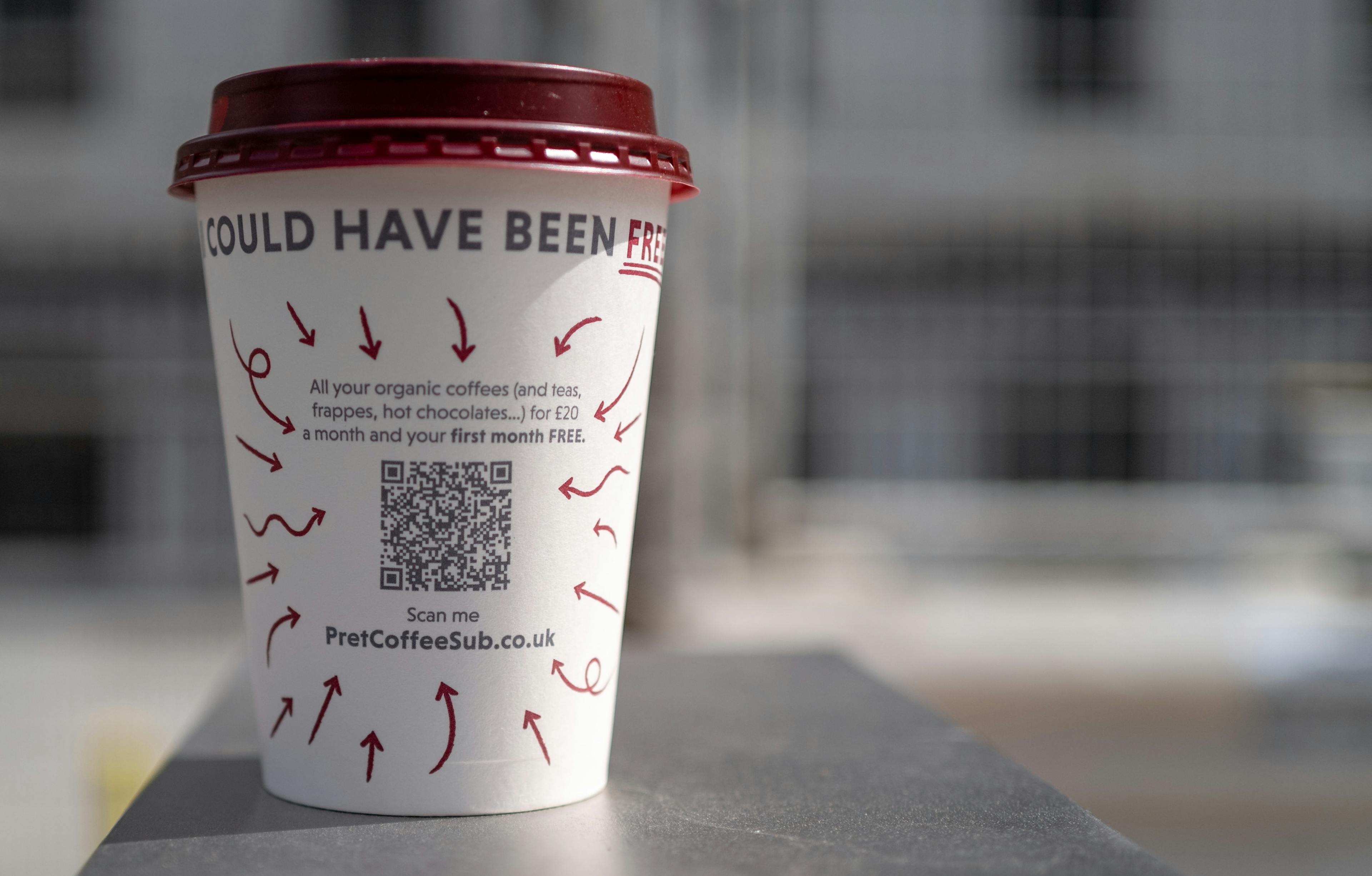 A coffee cup with a QR code on it. 