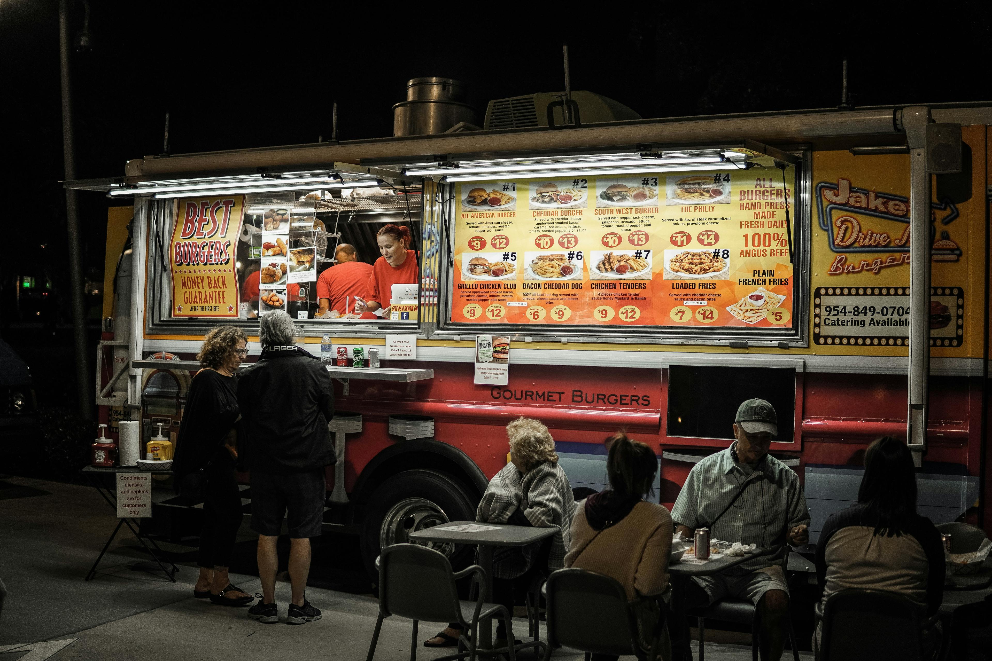 A food truck with a large menu. 