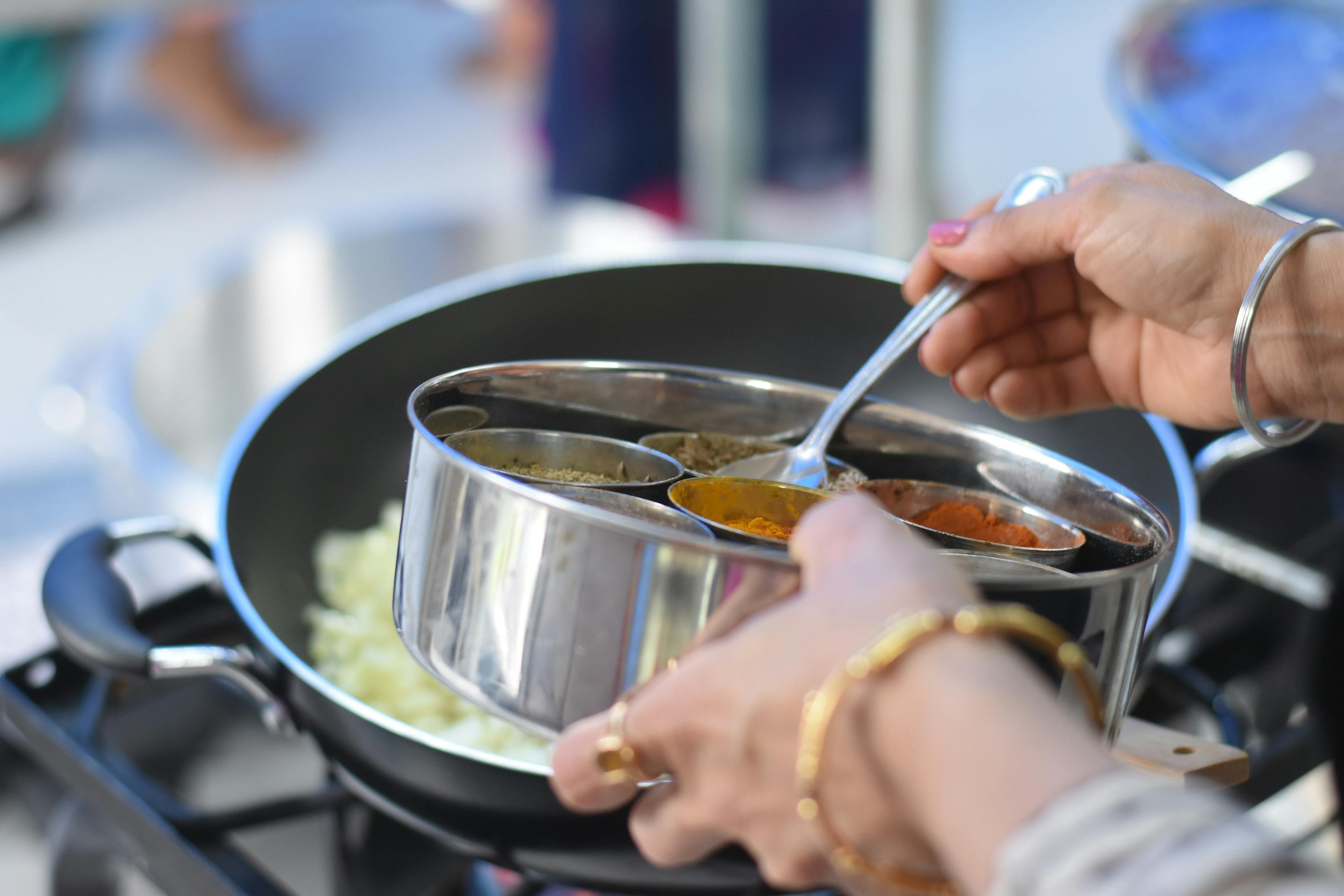 A meal being prepared in an Indian food truck. 