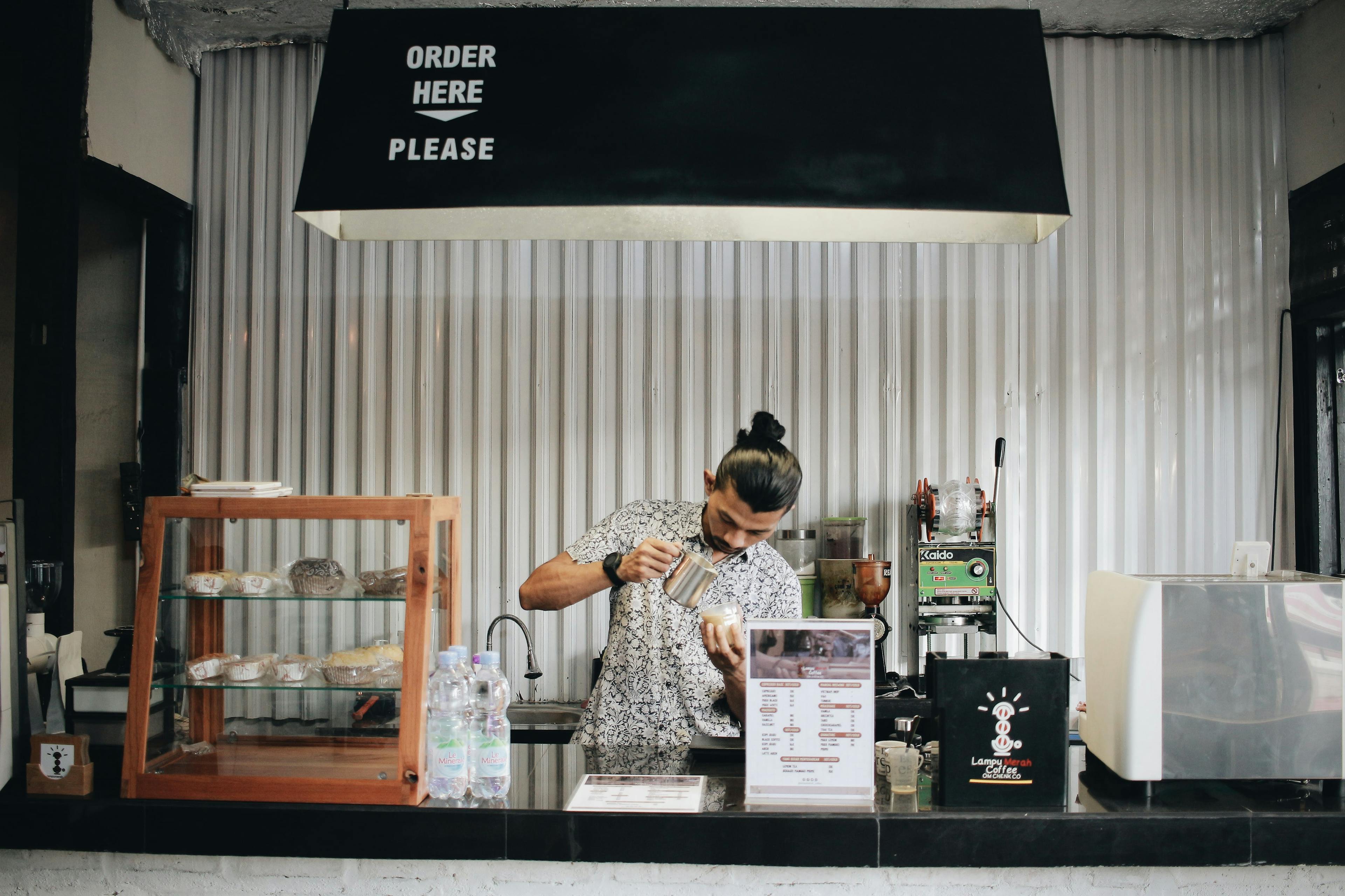 A barista in a cafe. 