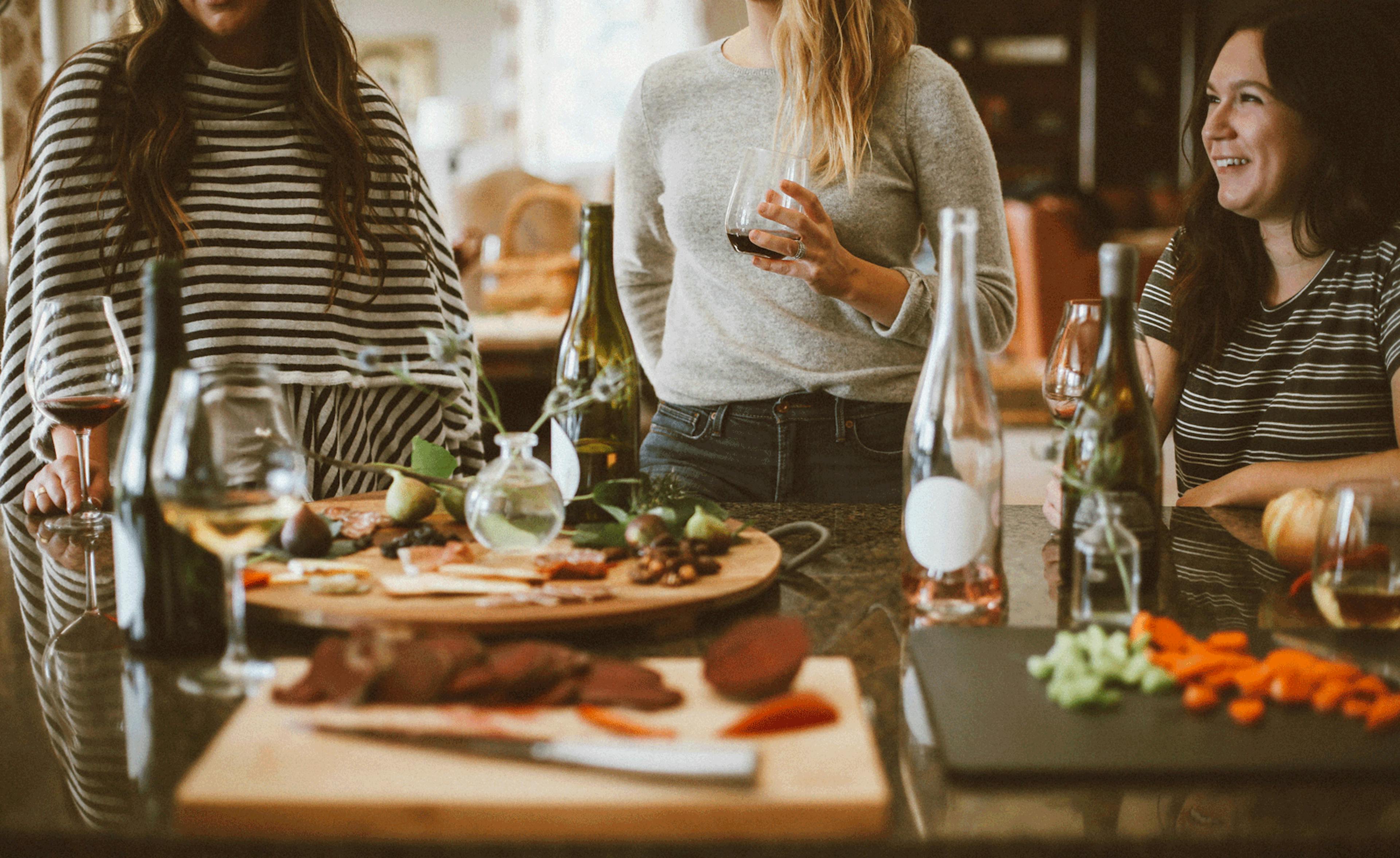 Group of three women celebrating friendsgiving