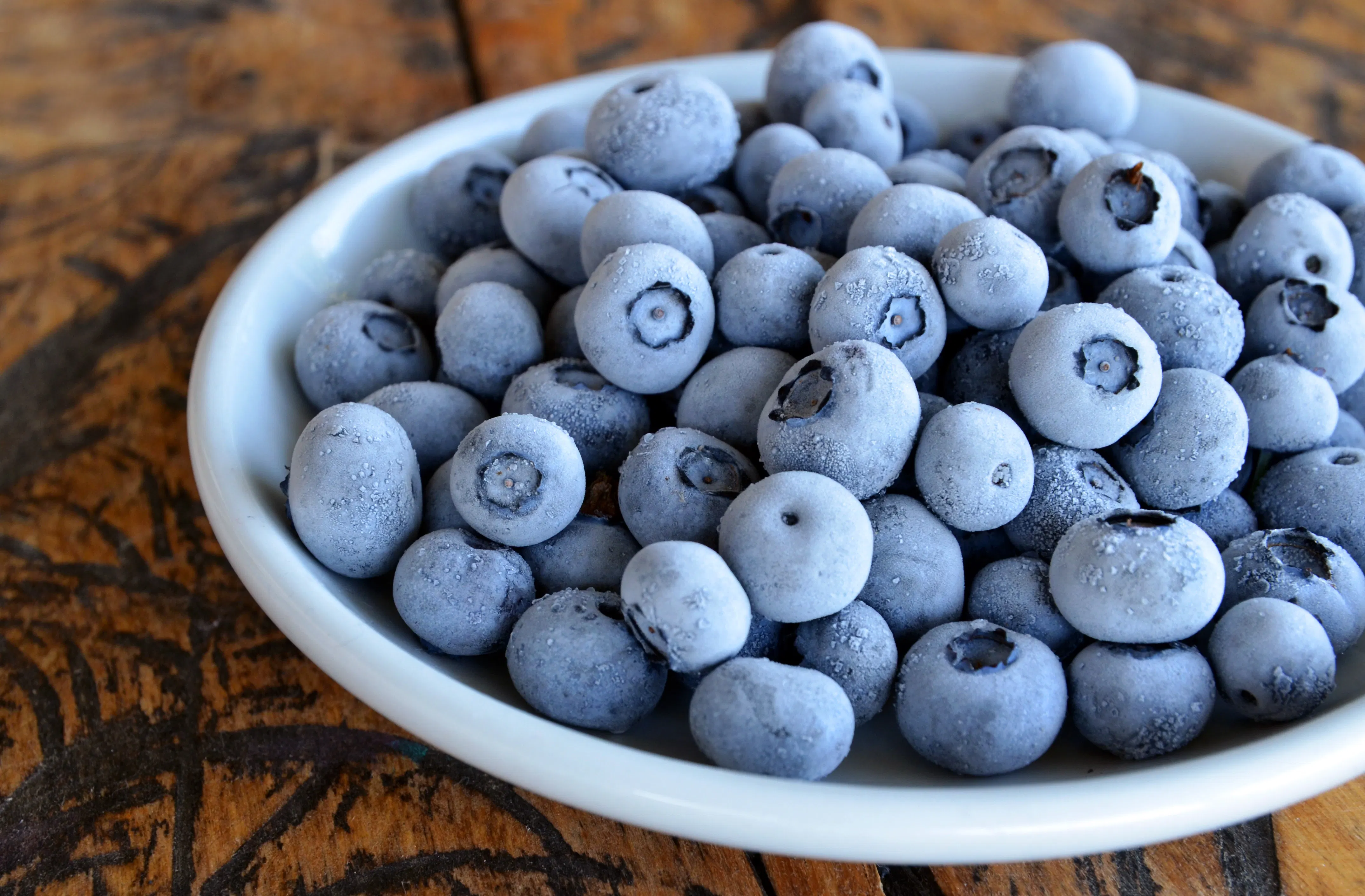 Frozen blueberries in a bowl.