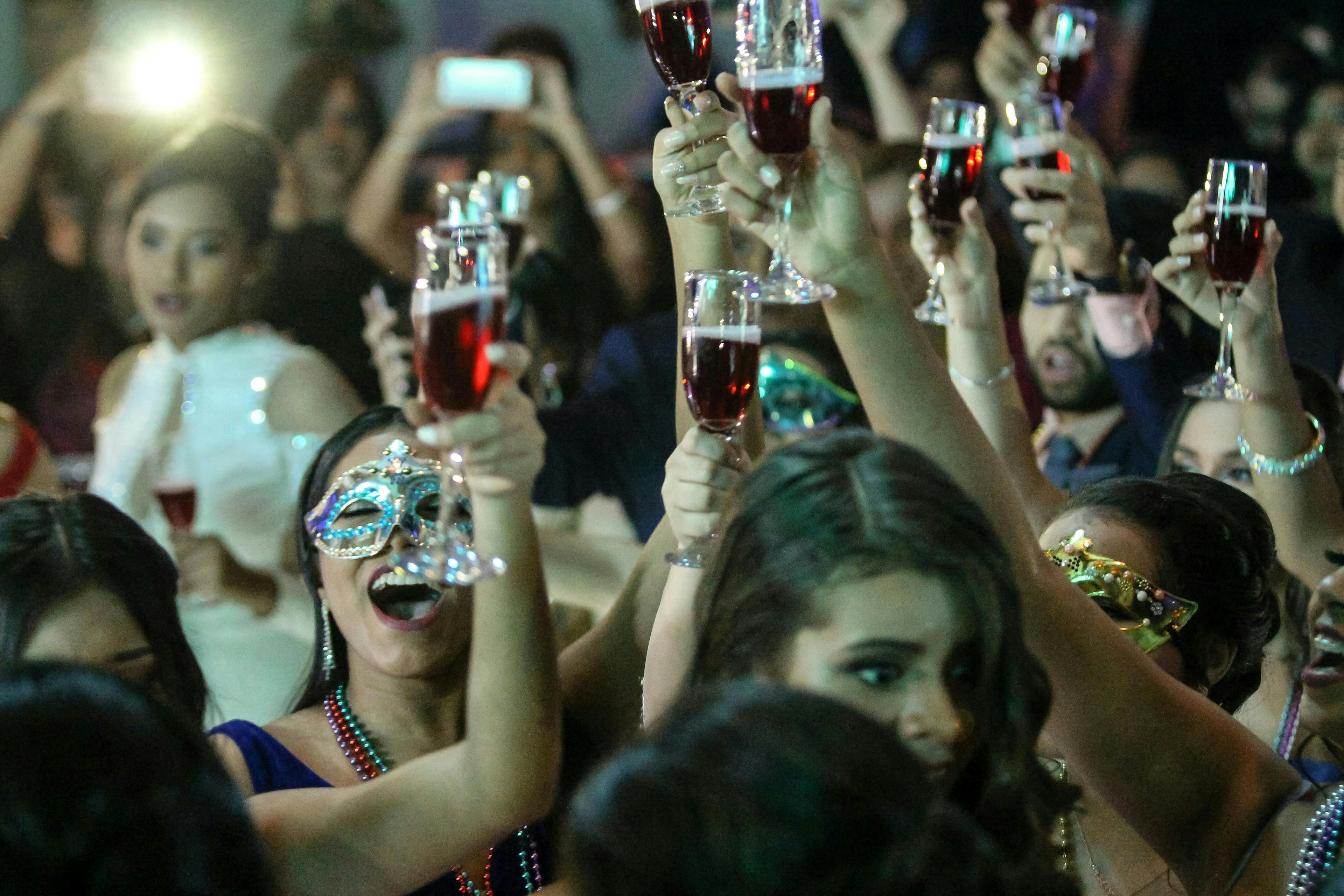 Customers having drinks at an eatertainment venue. 