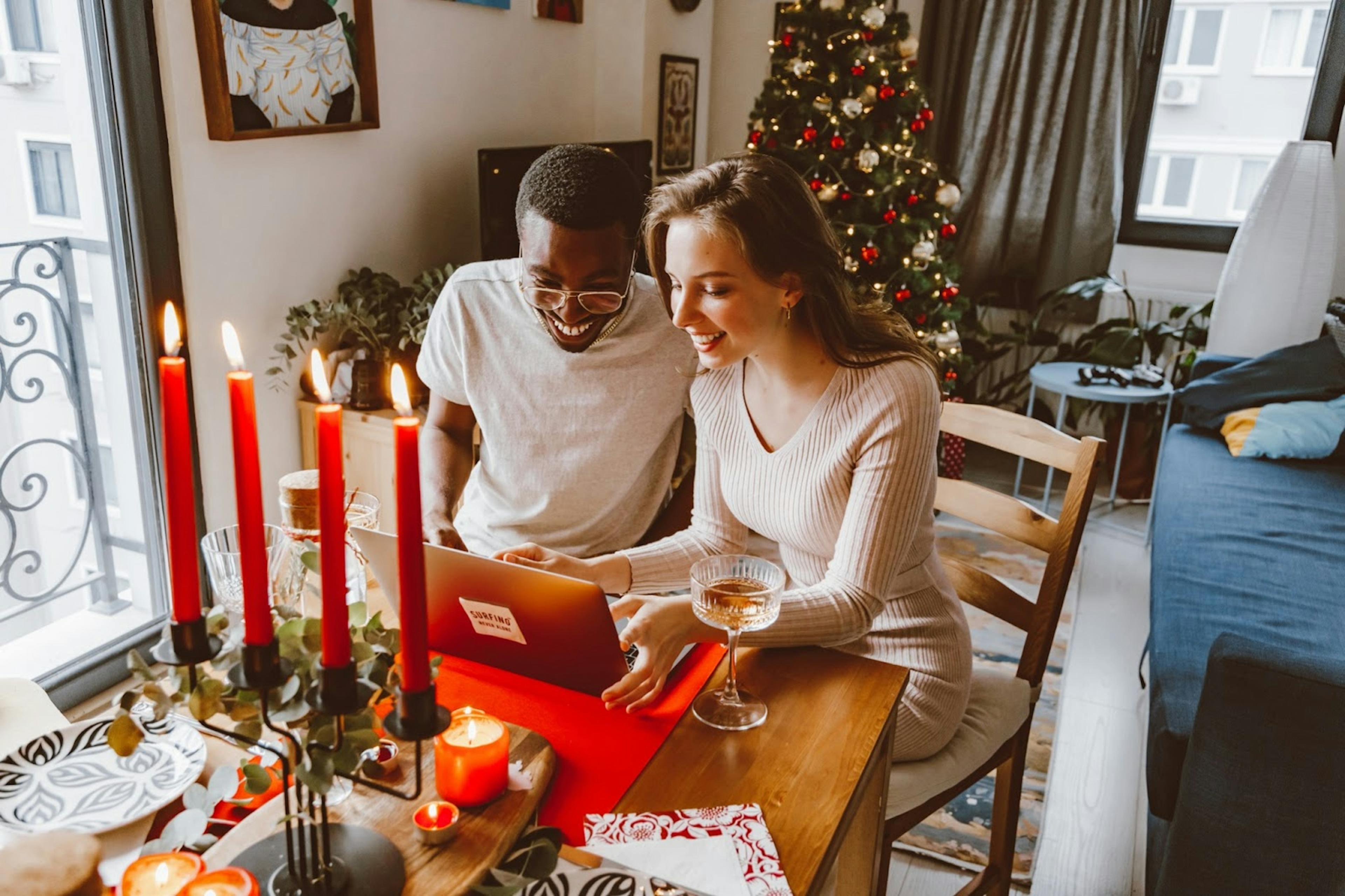 Image of a couple Facetiming with their family during the holidays