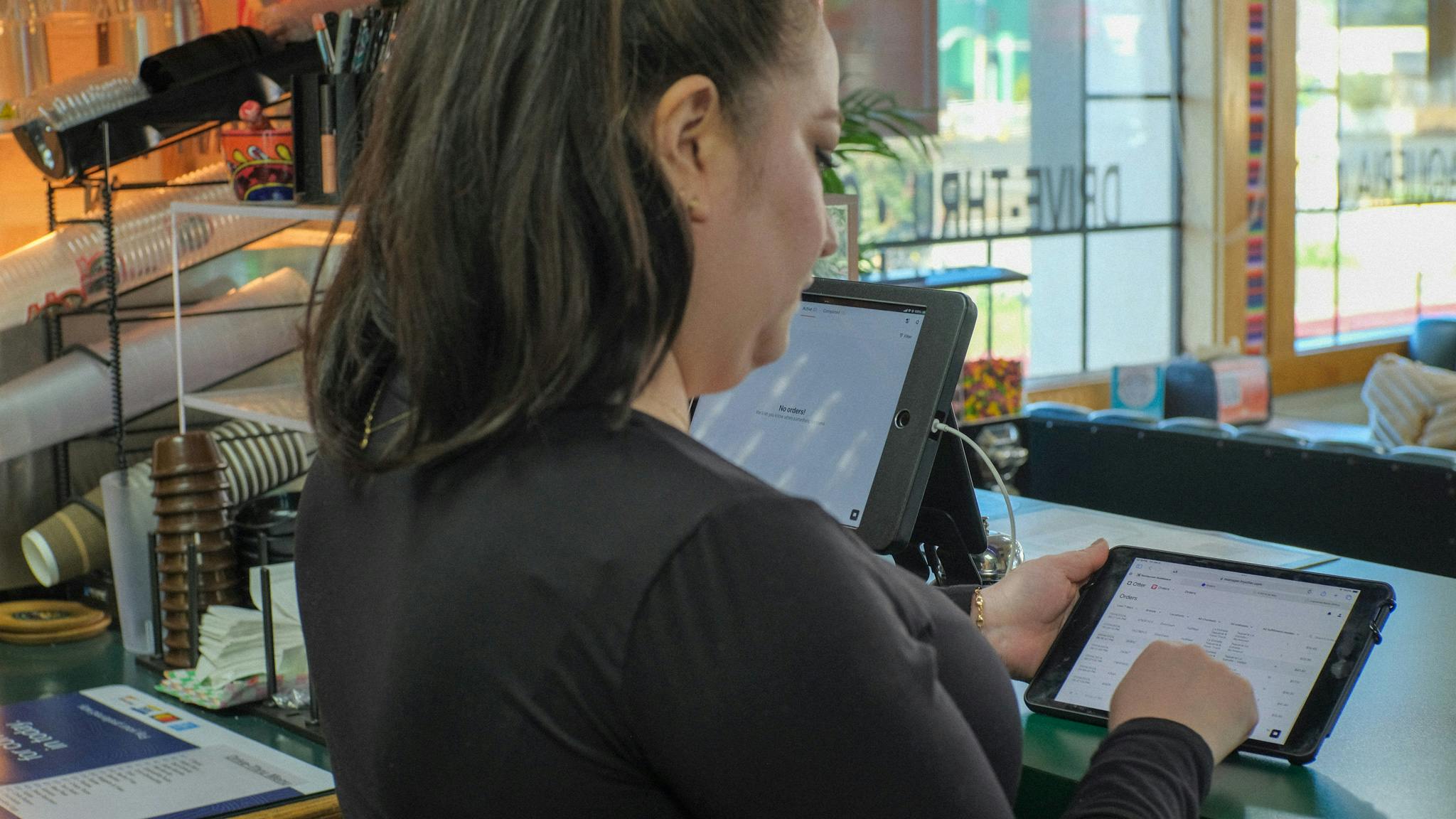 Otter's Restaurant Operating System being used by a restaurant staff member.
